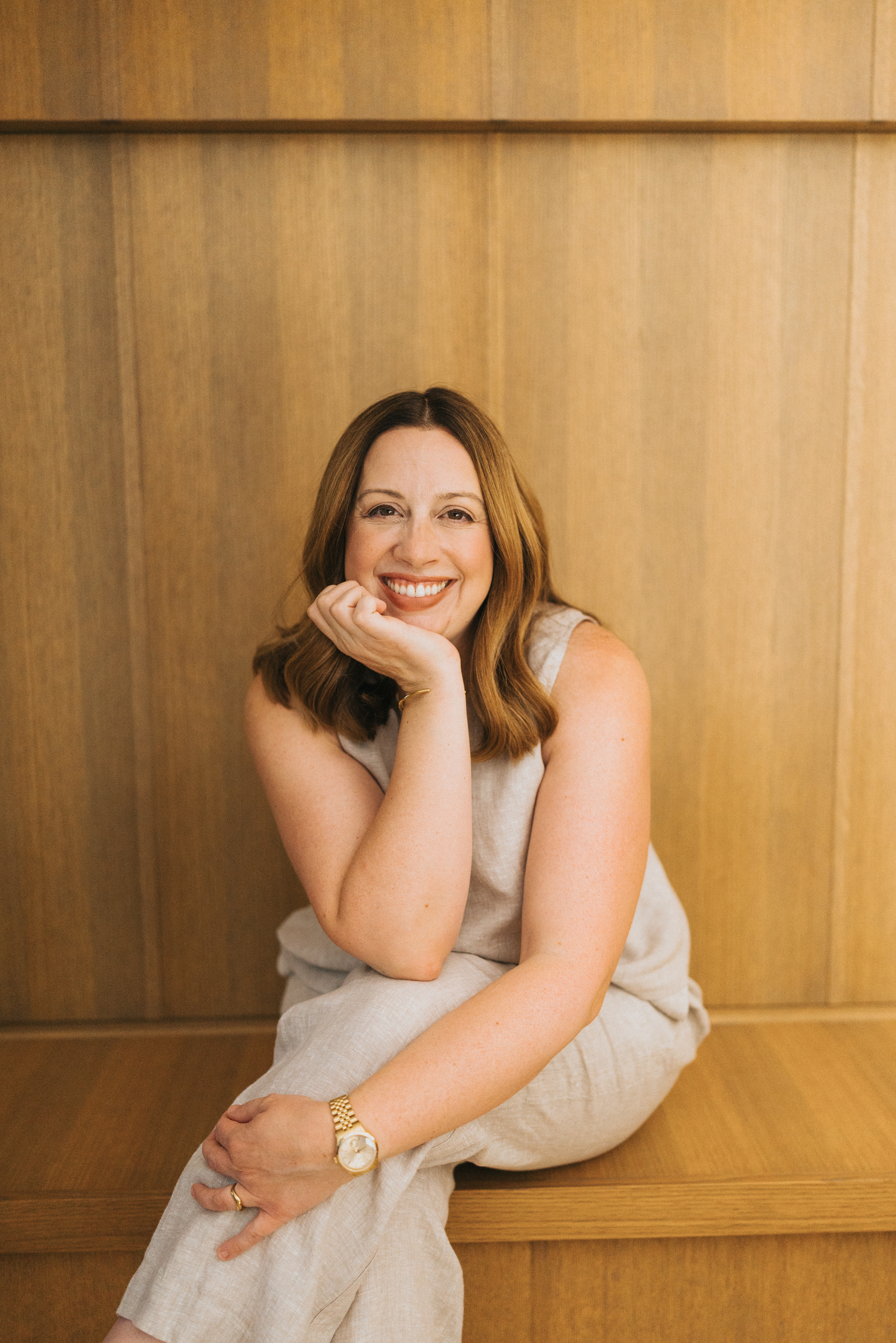 Richelle seated on yellow chair